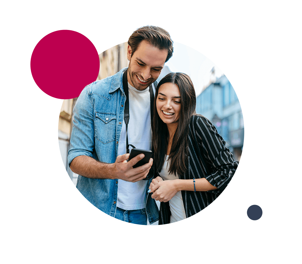 man and woman looking at phone